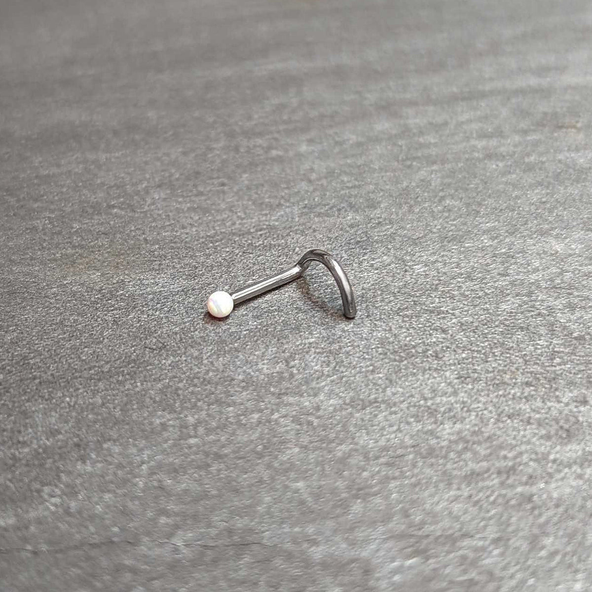 18G 1/4 White Synth Opal G23 Titanium Threadless Left Nose Screw