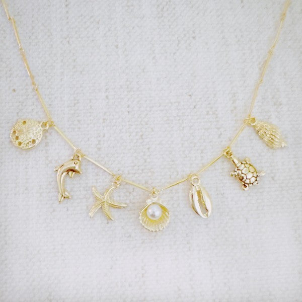 Golden Sea Charm Necklace – Shell, Dolphin & Starf